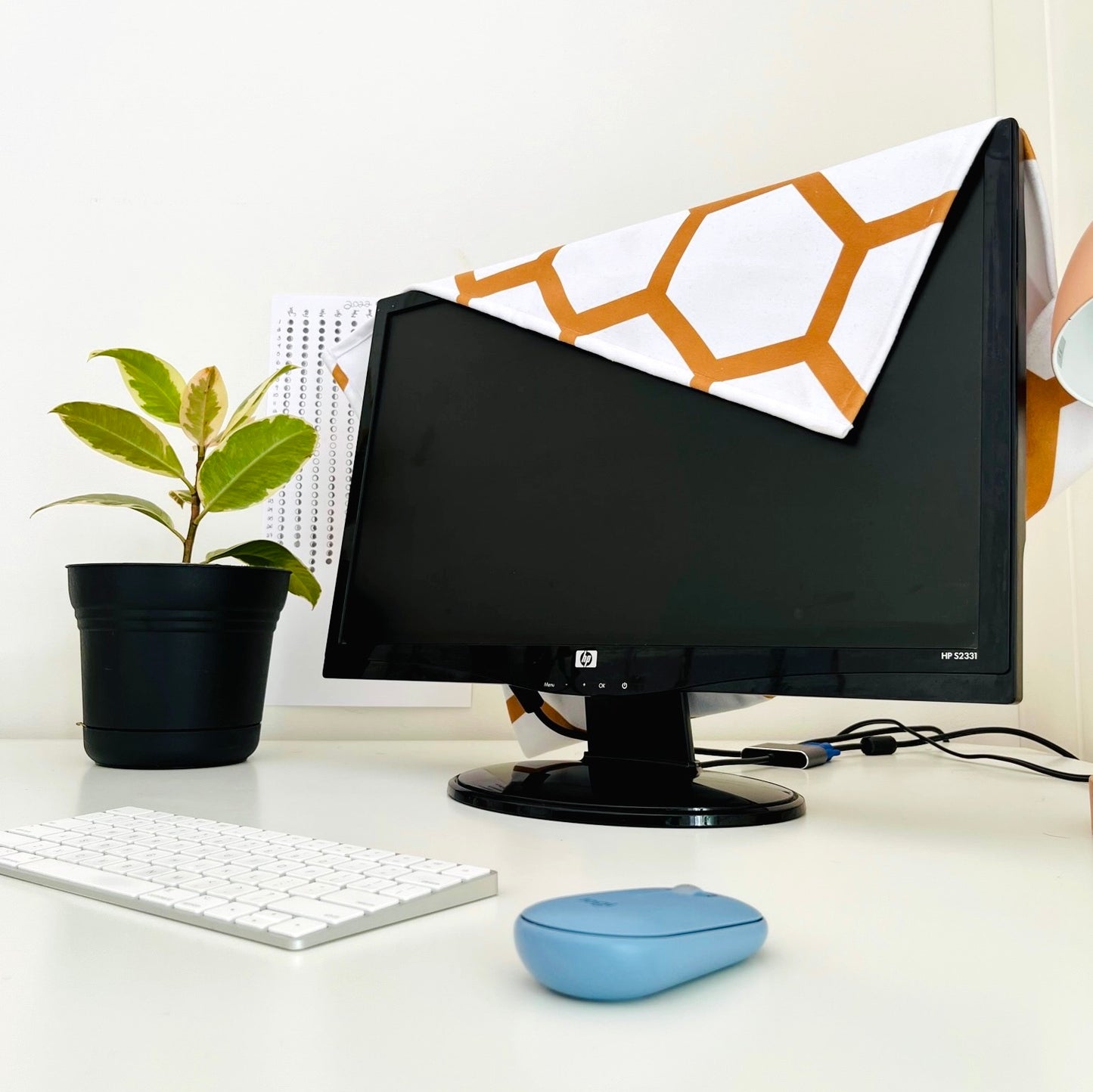 bee free monitor cover on home office desk