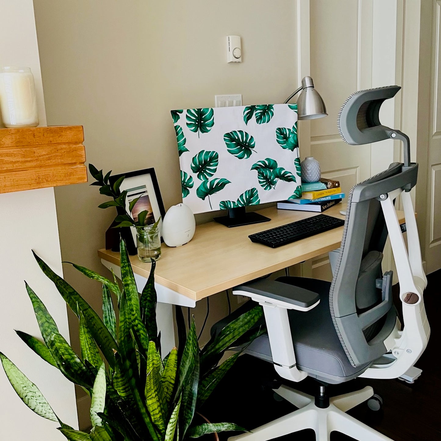 Computer monitor cover with Leaf the Day pattern print on a desktop PC monitor on a home office desk